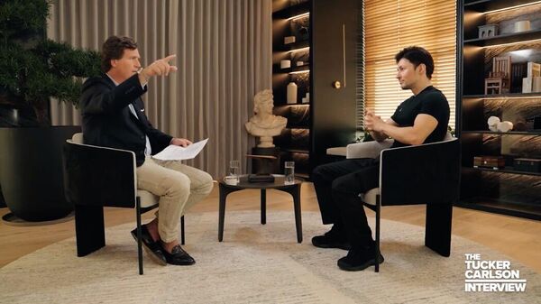 A screenshot from a video of Tucker Carlson interviewing Russian-born IT entrepreneur and co-founder of the Telegram social network Pavel Durov. - Sputnik International