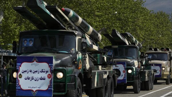 Missiles are carried on trucks during Army Day parade at a military base in northern Tehran - Sputnik International