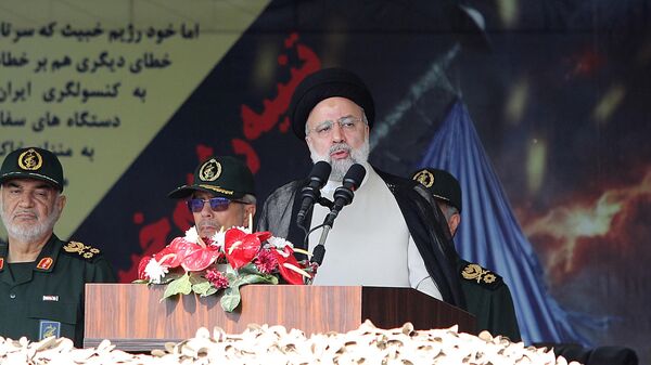 Iran's President Ebrahim Raisi attends a military parade alongside high-ranking officials and commanders - Sputnik International