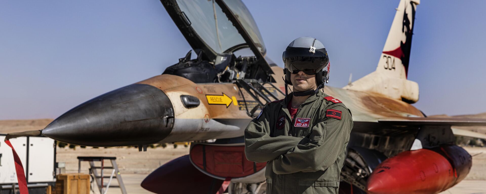 An Israeli F-16 pilot pose for a photo during the bi-annual multi-national aerial exercise known as the Blue Flag, at Ovda airbase near Eilat, southern Israel, Sunday, Oct. 24, 2021 - Sputnik International, 1920, 20.04.2024