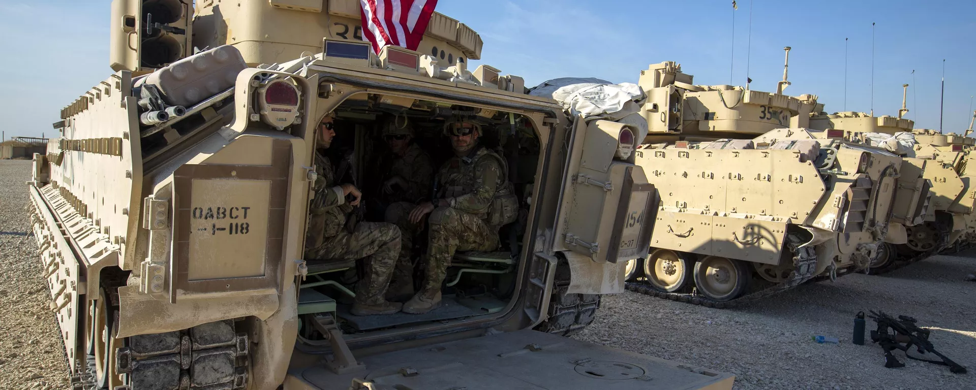 Crewmen sit inside Bradley fighting vehicles at a US military base at an undisclosed location in Northeastern Syria, Monday, Nov. 11, 2019. - Sputnik International, 1920, 13.12.2024