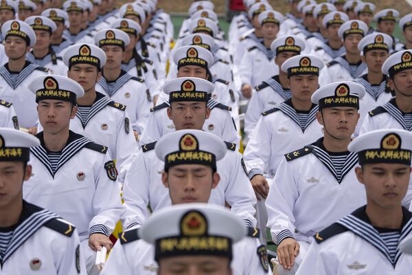 Chinese sailors sit in rows a day before the opening of the West Pacific Naval Symposium in Qingdao in eastern China&#x27;s Shandong province. - Sputnik International