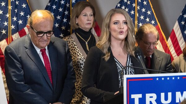 Members of President Donald Trump's legal team, including former Mayor of New York Rudy Giuliani, left, Sidney Powell, and Jenna Ellis, speaking, attend a news conference at the Republican National Committee headquarters, Thursday Nov. 19, 2020 - Sputnik International