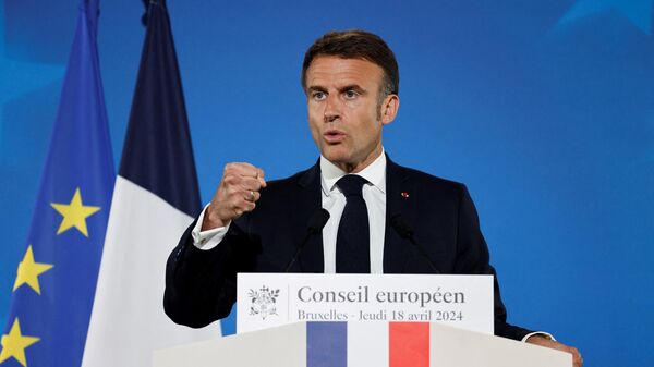 French President Emmanuel Macron gestures during a press conference at the end of the European Council summit at the EU headquarters in Brussels, on April 18, 2024. - Sputnik International