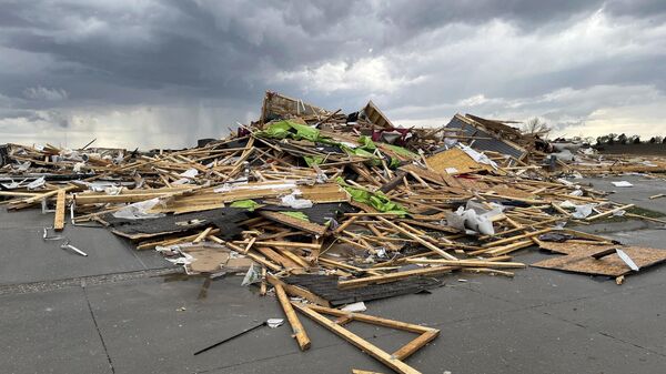 Debris is seen from a destroyed home northwest of Omaha, Neb., after a storm tore through the area on Friday, April 26, 2024 - Sputnik International