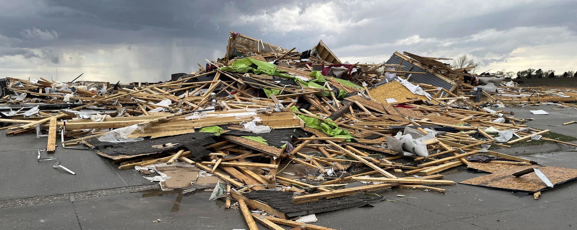 Debris is seen from a destroyed home northwest of Omaha, Neb., after a storm tore through the area on Friday, April 26, 2024 - Sputnik International, 1920, 27.04.2024