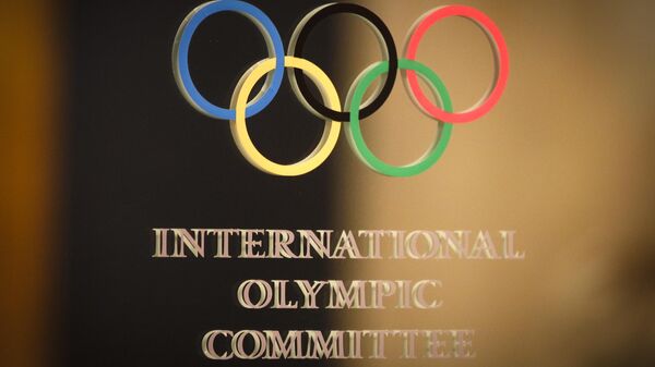 The International Olympic Committee (IOC) logo is seen on the door at a meeting of the IOC Executive Board at a hotel in London, prior to the 2012 Summer Olympics, Saturday, July 21, 2012 - Sputnik International