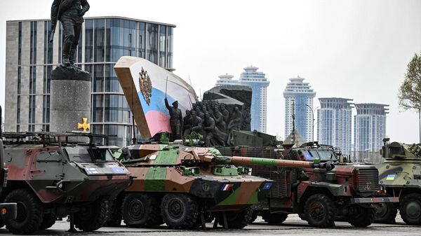A Patria Pasi XA-180 armoured personnel carrier (APC), AMX-10 RC armoured fighting vehicle and a Mastiff protected patrol vehicle are pictured before an opening of an exhibition of foreign-made military equipment captured in the course of Russia's military operation in Ukraine, on Poklonnaya Hill in Moscow - Sputnik International