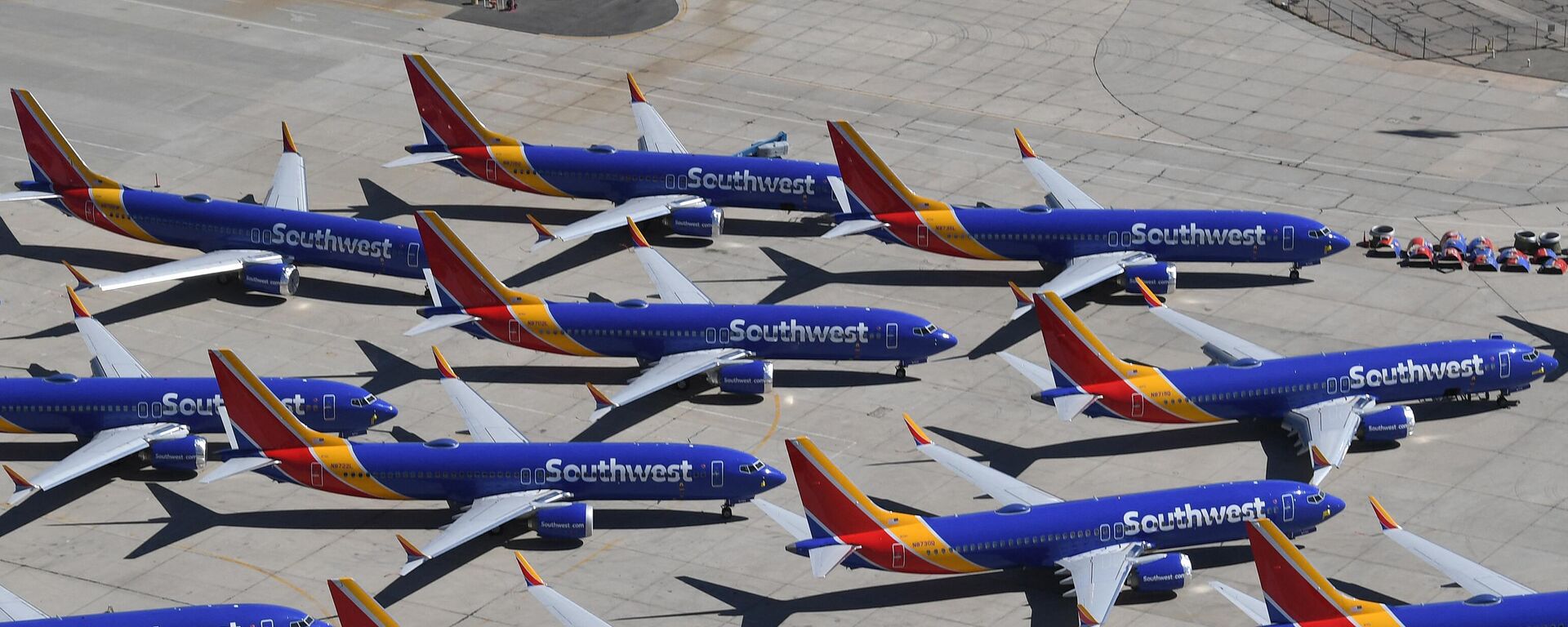 Southwest Airlines Boeing 737 MAX aircraft are parked on the tarmac after being grounded, at the Southern California Logistics Airport in Victorville, California, on March 28, 2019.  - Sputnik International, 1920, 02.05.2024