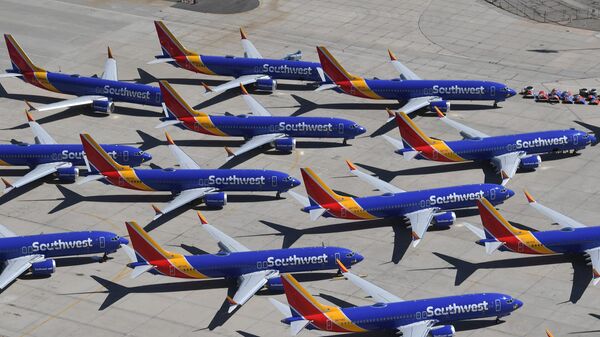 Southwest Airlines Boeing 737 MAX aircraft are parked on the tarmac after being grounded, at the Southern California Logistics Airport in Victorville, California, on March 28, 2019.  - Sputnik International