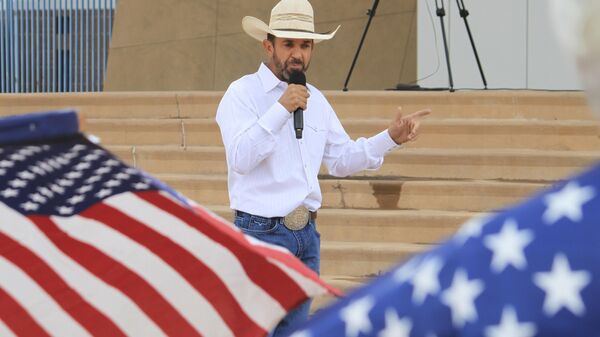 FILE - Couy Griffin, a former Otero County commissioner and cofounder of Cowboys for Trump, speaks during a gun rights rally in Albuquerque, New Mexico, Sept. 12, 2023. The Supreme Court has rejected an appeal by a former New Mexico county commissioner banished from public office for participating in the Jan. 6 Capitol insurrection. The court’s order Monday means former Otero County commissioner Couy Griffin remains disqualified from public office under a constitutional provision designed to prevent ex-Confederates from serving in government after the Civil War.  (AP Photo/Susan Montoya Bryan, File) - Sputnik International