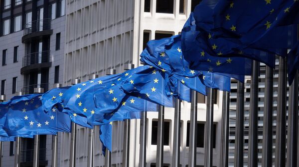 European Union flags fly outside the European Commission building in Brussel on April 12, 2024.  - Sputnik International