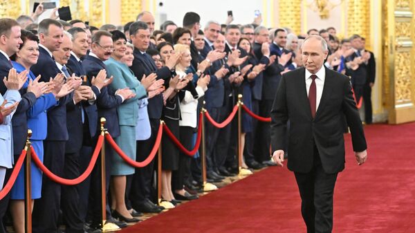 Russian President Vladimir Putin walks before his inauguration ceremony at the Kremlin in Moscow, Russia - Sputnik International