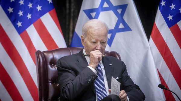 US President Joe Biden pauses during a meeting with Israeli Prime Minister Benjamin Netanyahu to discuss the war between Israel and Hamas, in Tel Aviv, Israel, Oct. 18, 2023 - Sputnik International