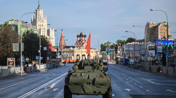 A Russian military vehicle drives along a road during a rehearsal for a military parade, which marks the 79th anniversary of the victory over Nazi Germany in World War Two, in Moscow, Russia. - Sputnik International