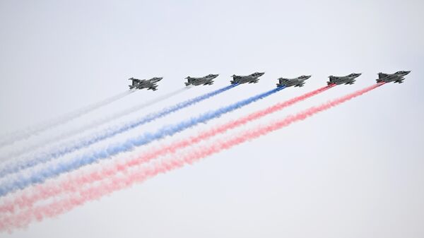 Russian Su-25 jet aircrafts release smoke in the colours of the Russian national flag during a military parade on Victory Day, which marks the 79th anniversary of the victory over Nazi Germany in World War Two, in Red Square in Moscow, Russia - Sputnik International