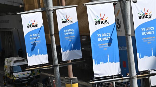 Banners with the BRICS logo at summit in South Africa in 2023. - Sputnik International