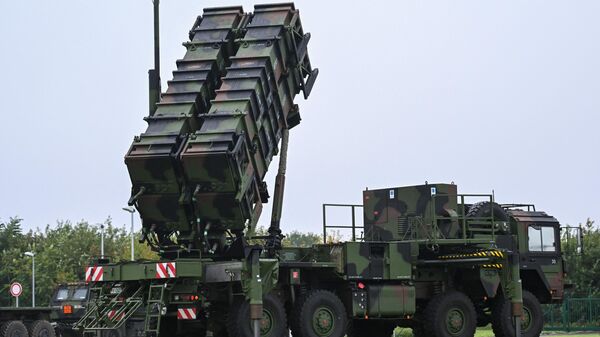 A Patriot missile system is pictured during the German Chancellor's visit at the military part of the airport in Cologne-Wahn, western Germany.  - Sputnik International