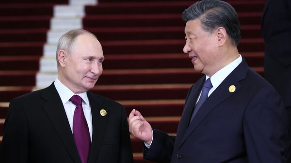 Russian President Vladimir Putin and President of the People's Republic of China (PRC) Xi Jinping (right)  on October 17, 2023. - Sputnik International