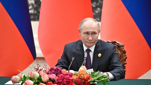Russian President Vladimir Putin makes a joint statement with Chinese President Xi Jinping following a meeting in expanded format at the Great Hall of the People in Beijing, China - Sputnik International