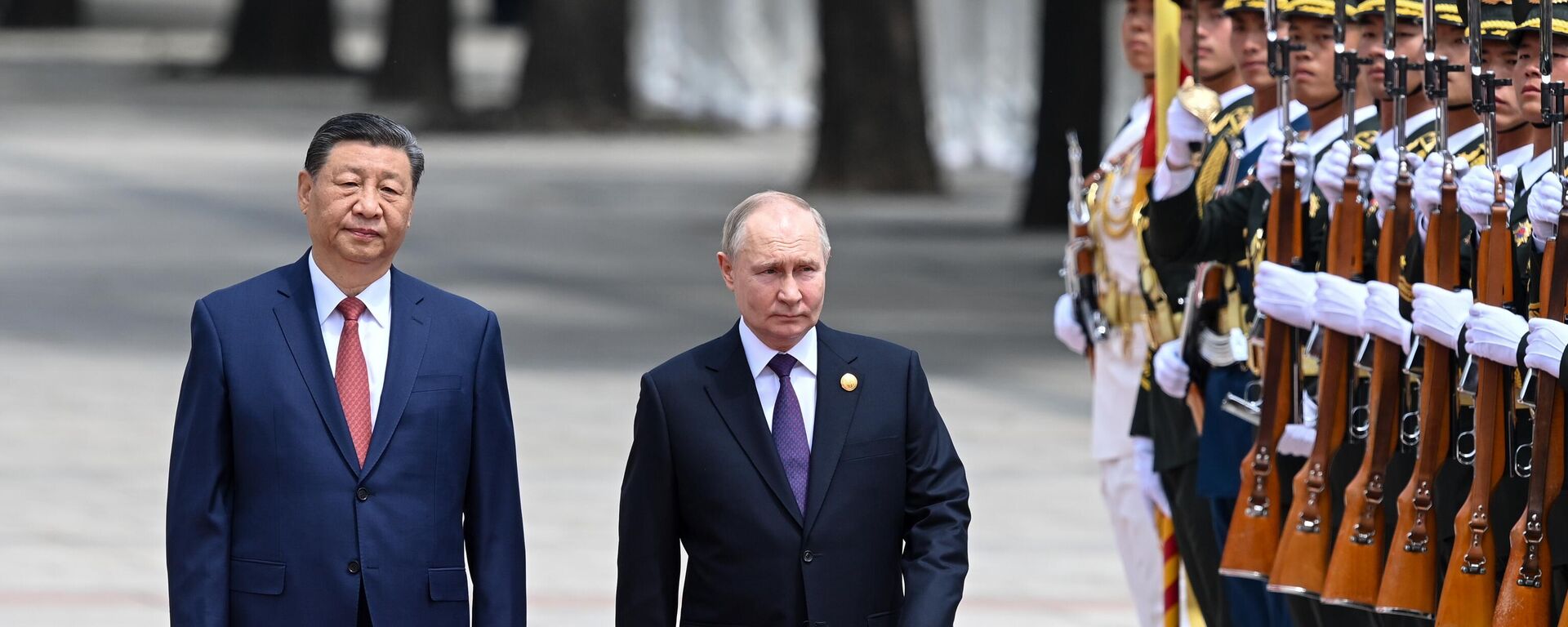 Russian President Vladimir Putin attends a welcome ceremony with Chinese President Xi Jinping outside the Great Hall of the People in Beijing, China. Russian President Vladimir Putin attends a welcome ceremony with Chinese President Xi Jinping outside the Great Hall of the People in Beijing, China. - Sputnik International, 1920, 21.01.2025