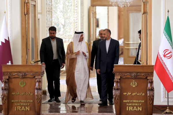 Iran&#x27;s Foreign Minister Hossein Amir-Abdollahian (right) and Qatar&#x27;s Foreign Minister Mohammed bin Abdulrahman bin Jassim Al Thani (center) arrive for a joint press conference at the Foreign Ministry headquarters in the capital Tehran, July 7, 2022. The bilateral talks mainly sought to revive Iran&#x27;s nuclear deal following similar discussions between Iran and the US hosted in Qatar&#x27;s Doha. - Sputnik International