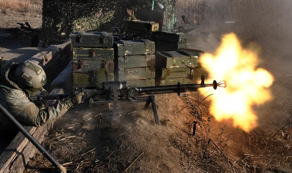 A serviceman fires a heavy machine gun during Pacific Fleet drills. - Sputnik International