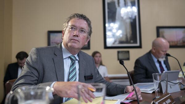 Rep. Thomas Massie, R-Ky., listens as the House Rules Committee prepares a bill to reverse a Biden administration firearms-related regulation on so-called pistol braces, a stabilizing feature championed by some members of the conservative House Freedom Caucus, at the Capitol in Washington, Monday, June 12, 2023 - Sputnik International