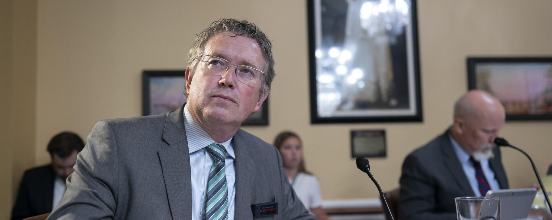 Rep. Thomas Massie, R-Ky., listens as the House Rules Committee prepares a bill to reverse a Biden administration firearms-related regulation on so-called pistol braces, a stabilizing feature championed by some members of the conservative House Freedom Caucus, at the Capitol in Washington, Monday, June 12, 2023 - Sputnik International, 1920, 25.05.2024