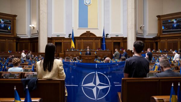 NATO Secretary General Jens Stoltenberg (C) addresses Ukrainian lawmakers at the parliament during his visit to Ukraine amid the Russian invasion in Kyiv on April 29, 2024.  - Sputnik International