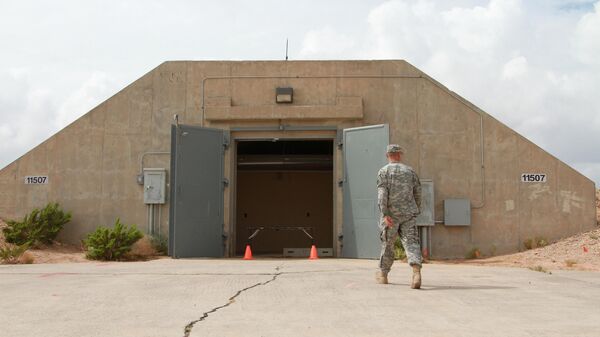Lt. Col. Jason Crowe walks toward a radiation contaminated bunker at Ft. Bliss, Texas, Friday, June 19, 2013 - Sputnik International