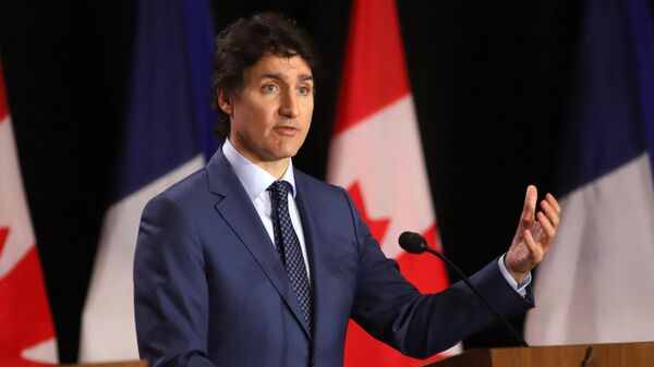 Canadian Prime Minister Justin Trudeau speaks during a joint press conference with French Prime Minister Gabriel Attal (out of frame) at the Sir John A. Macdonald building in Ottawa on April 11, 2024. - Sputnik International