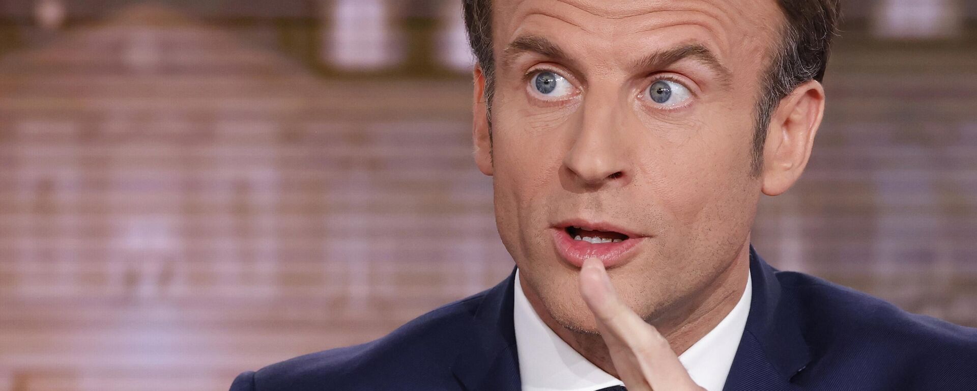 French President and centrist candidate for reelection Emmanuel Macron gestures during the evening news broadcast of French TV channel TF1, in Boulogne-Billancourt, outside Paris, Wednesday, April 13, 2022 - Sputnik International, 1920, 11.06.2024