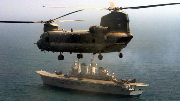 A British Royal Air Force Chinook flies over the HMS Ark Royal. File photo - Sputnik International