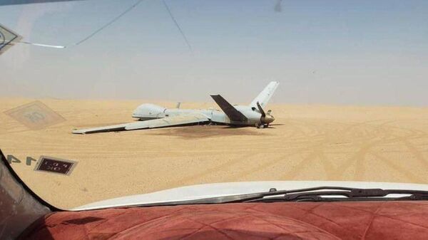 $31 million US MQ-9 Reaper drone lies in a desert in Marib, Yemen after being shot down by Houthi air defenses. - Sputnik International