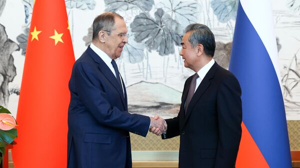 Russian Foreign Minister Sergey Lavrov and Chinese Foreign Minister Wang Yi - Sputnik International