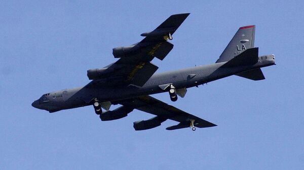 A U.S. B-52 Stratofortress bomber flies over East Hagatna in Guam on Monday afternoon, March 10, 2003.  - Sputnik International