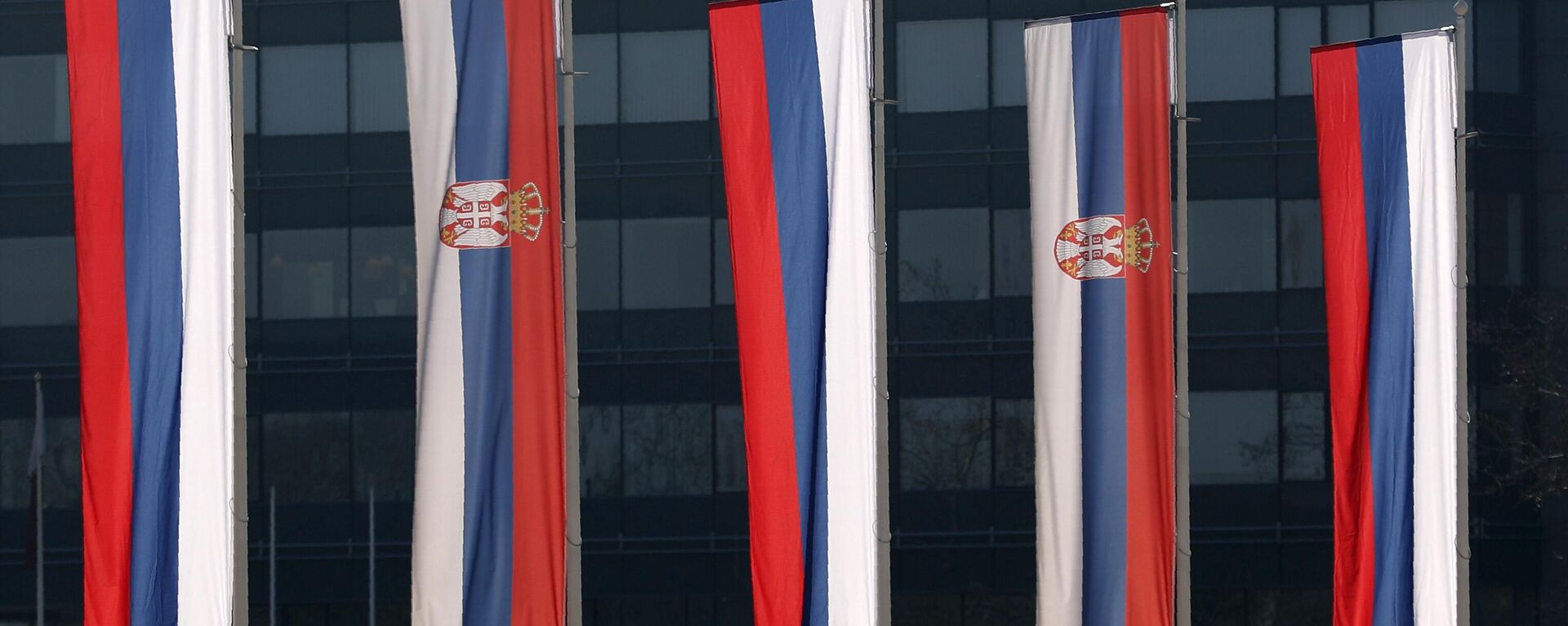 Serbian and Russian flags wave in front of the Serbia Palace during Russian Defense Minister Sergei Shoigu's visit in Belgrade, Serbia, Monday, Feb. 17, 2020 - Sputnik International, 1920, 25.06.2024