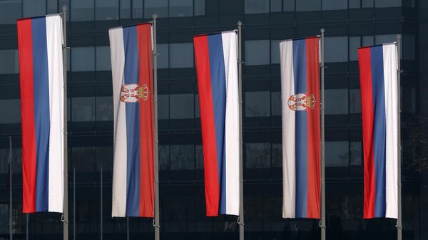 Serbian and Russian flags wave in front of the Serbia Palace during Russian Defense Minister Sergei Shoigu's visit in Belgrade, Serbia, Monday, Feb. 17, 2020 - Sputnik International