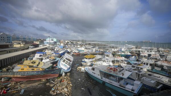 Fishing vessels lie damaged after Hurricane Beryl passed through the Bridgetown Fisheries in Barbados, Monday, July 1, 2024. (AP Photo/Ricardo Mazalan) - Sputnik International