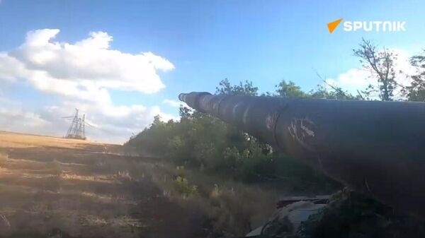 Battlegroup Tsentr's T72B3M tank unleashes its firepower, snuffing out a Ukrainian stronghold near Avdeyevka. - Sputnik International