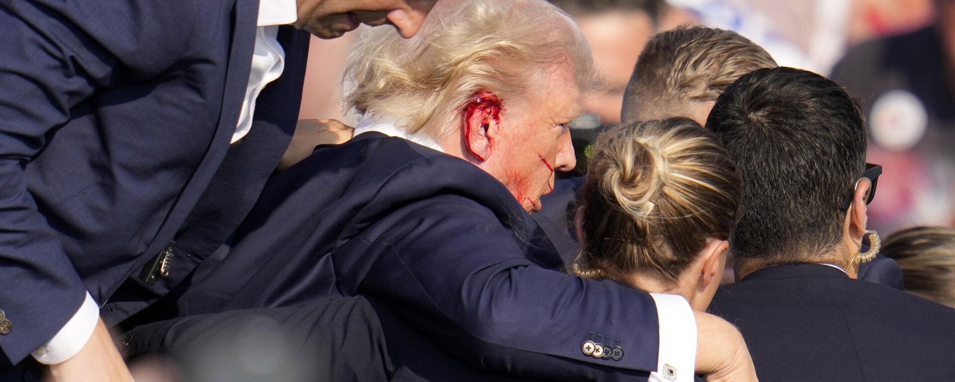 Republican presidential candidate former President Donald Trump is helped off the stage at a campaign event in Butler, Pa., on Saturday, July 13, 2024.  - Sputnik International, 1920, 19.07.2024