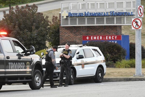 Pennsylvania State Troopers guard the entrance to Butler Memorial Hospital, where Trump was said to be taken after the shooting at his campaign rally in Butler, Pa. - Sputnik International