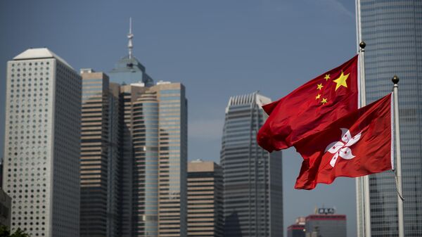 State flags of China and Hong Kong at the governmental buildings area - Sputnik International