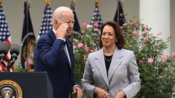 US President Joe Biden, with Vice President Kamala Harris, salutes after announcing the White House Office of Gun Violence Prevention, in the Rose Garden of the White House in Washington, DC, September 22, 2023.  - Sputnik International