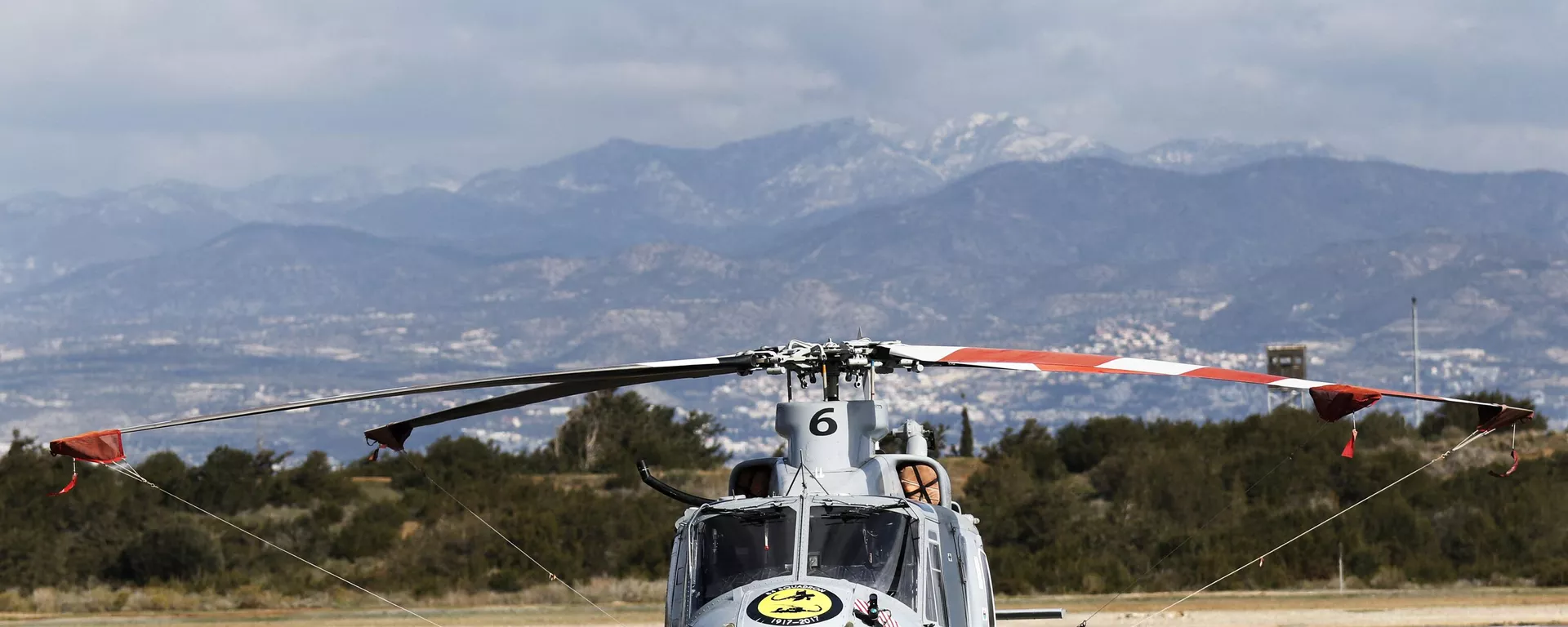 A Griffin HAR2 helicopter from the RAF Akrotiri multi-role 84 Squadron sits on the tarmac during a parade marking the centenary of the 84 Squadron at the Sovereign Base Area (SBA) of Akrotiri, a British overseas territory located ten kilometres west of the Cypriot port city of Limassol, on February 16, 2017. - Sputnik International, 1920, 23.07.2024