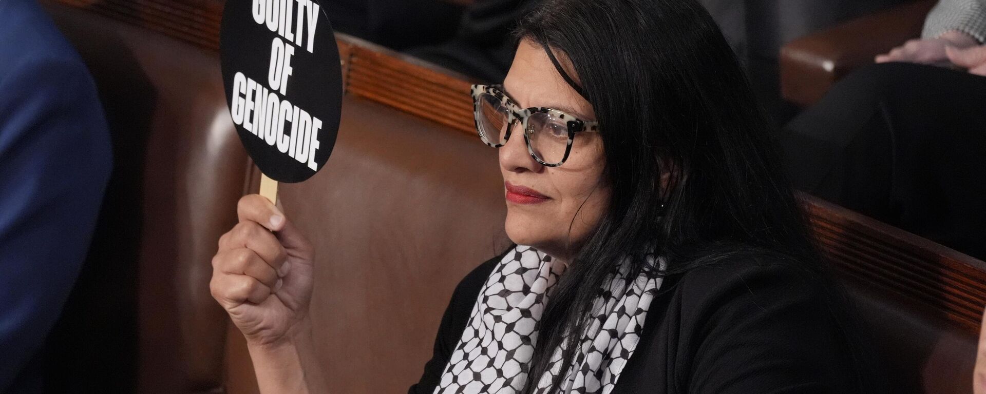 Rep. Rashida Tlaib, D-Mich., holds a sign as she attends a speech by Israeli Prime Minister Benjamin Netanyahu to a joint meeting of Congress at the Capitol in Washington, Wednesday, July 24, 2024. (AP Photo/J. Scott Applewhite) - Sputnik International, 1920, 24.07.2024