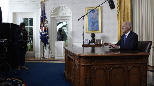 President Joe Biden addresses the nation from the Oval Office of the White House in Washington, Wednesday, July 24, 2024, about his decision to drop his Democratic presidential reelection bid. (AP Photo/Evan Vucci, Pool) - Sputnik International