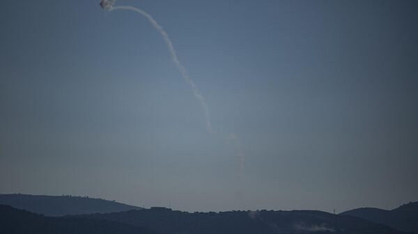 Israeli Iron Dome air defense system fires to intercept an alleged attack from Lebanon over the Galilee region as seen from the Golan Heights, Thursday, July 18, 2024. - Sputnik International