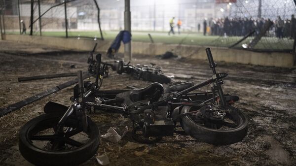 Bicycles sit next to the area that was hit by a rocket that killed multiple children and teenagers at a soccer field in the Druze town of Majdal Shams - Sputnik International